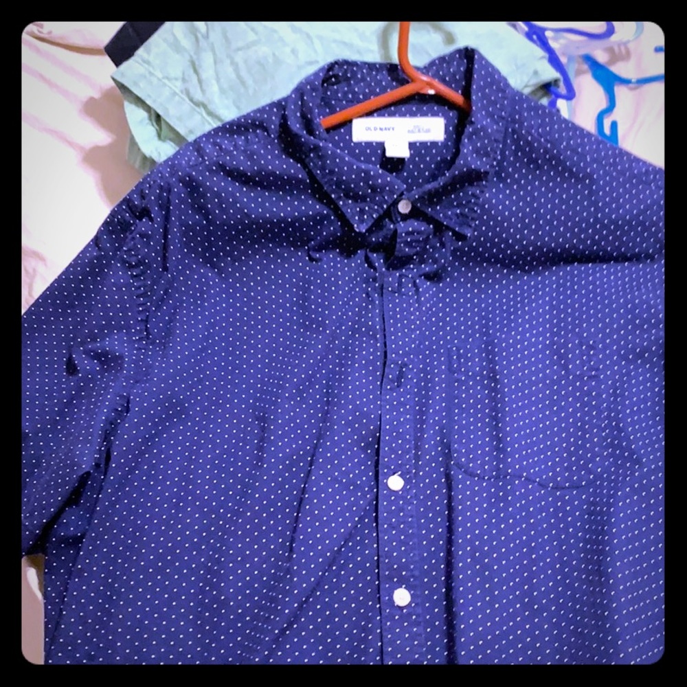 button down shirt , blue in color with white dots.